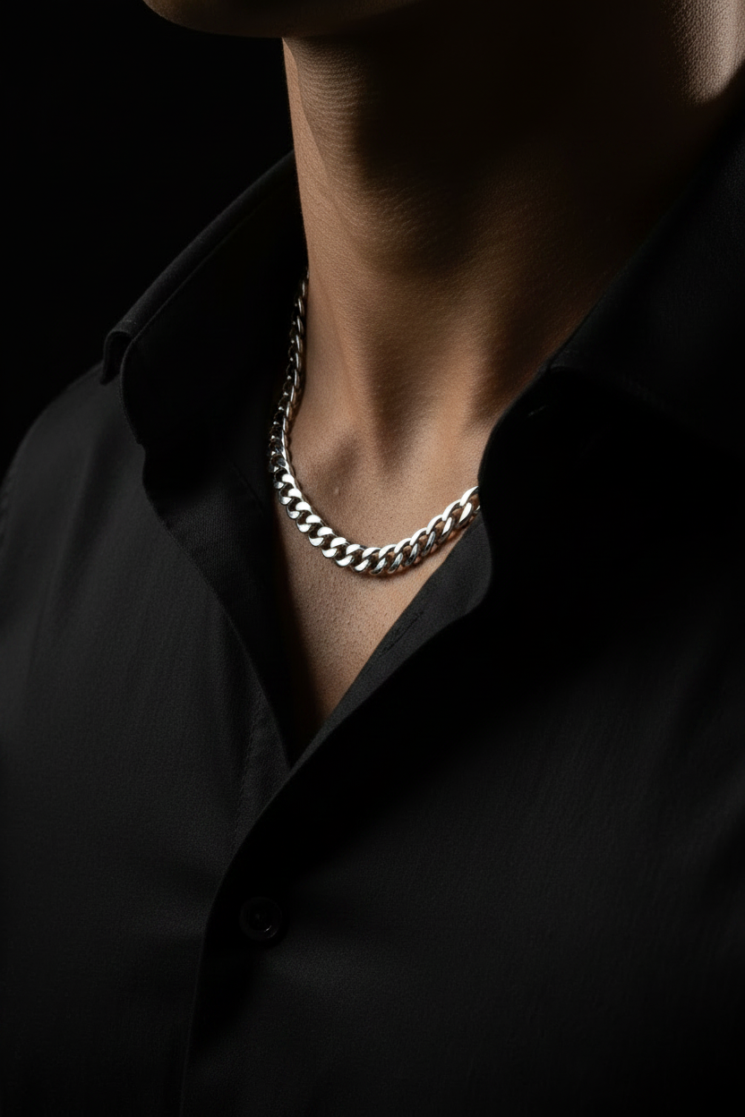 Man wearing 925 sterling silver Cuban link chain necklace, olive skin, black dress shirt